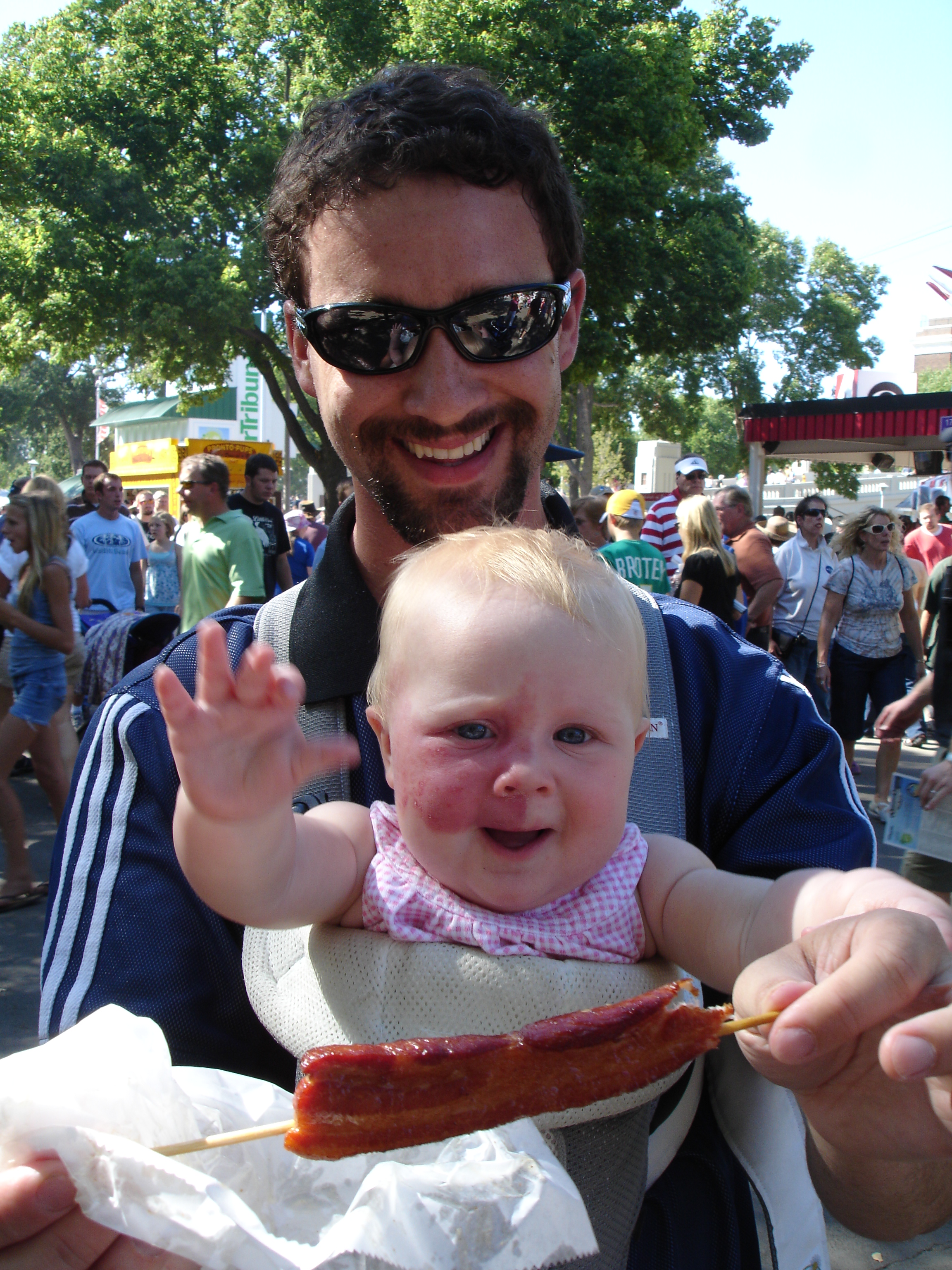 Addy in baby bjorn with bacon