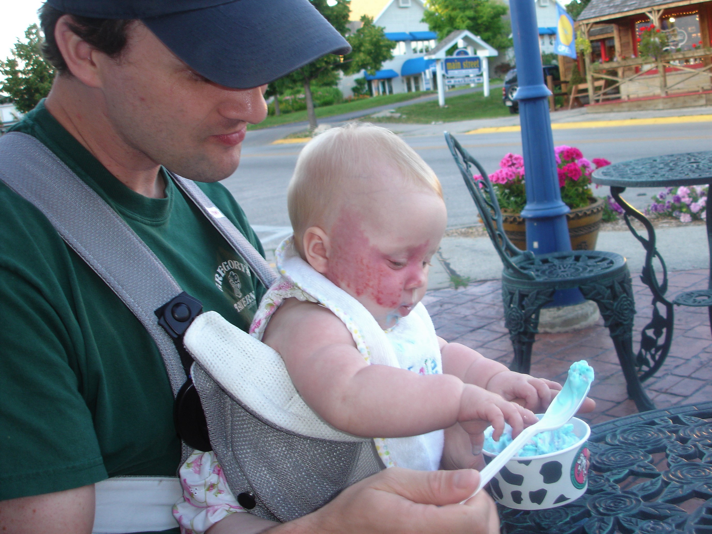 Addy in baby bjorn with ice cream